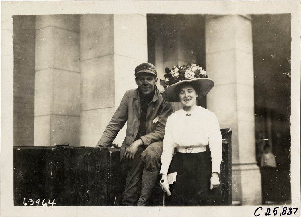 Couple posing with luggage, 1910 Munsey Historic Tour