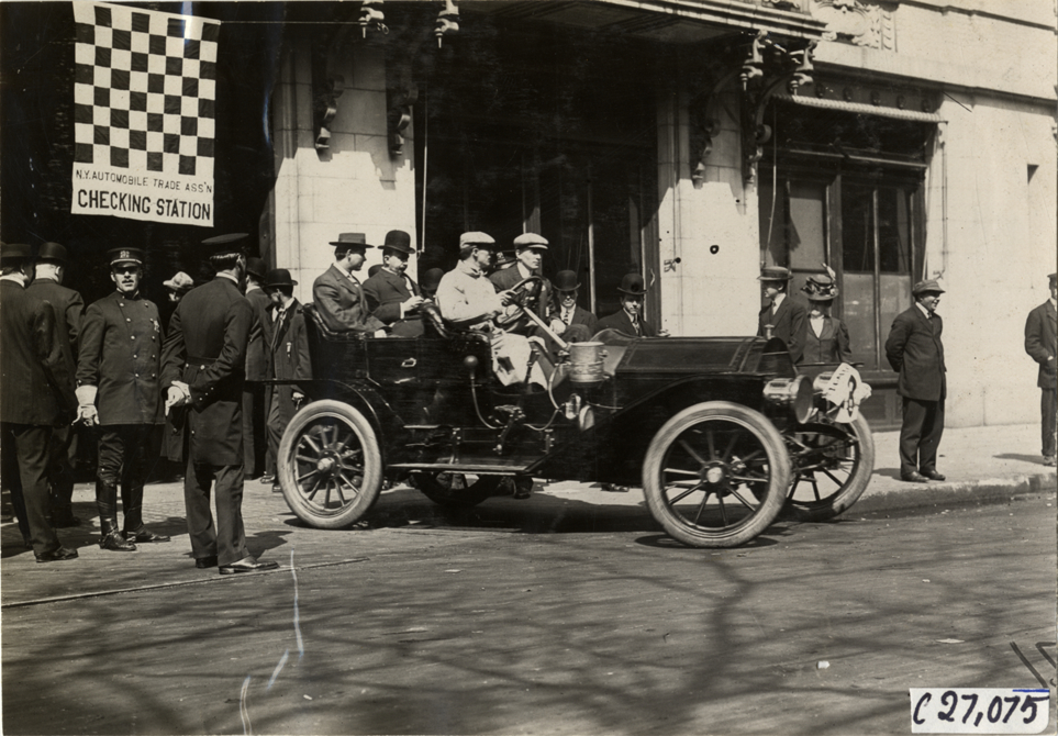Motorists in automobile at checking station, 1909 New York Economy Contest