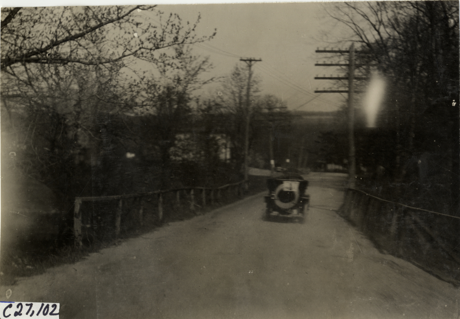 Automobile traveling on rural road, 1909 New York Economy Contest