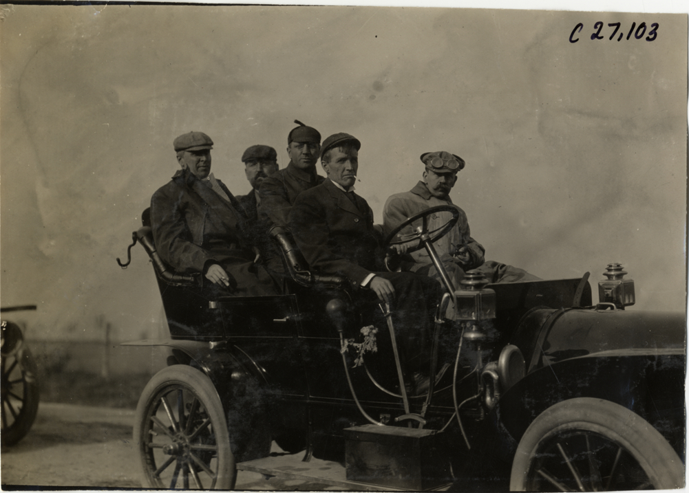 Motorists posing in automobile, 1909 New York Economy Contest
