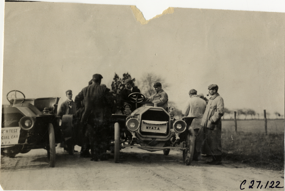 Motorists with automobiles on rural road, 1909 New York Economy Contest