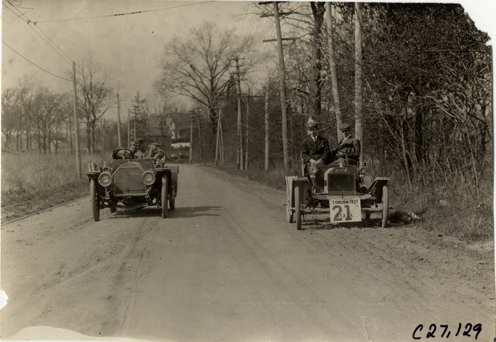 Motorists in automobiles on rural road, 1909 New York Economy Contest