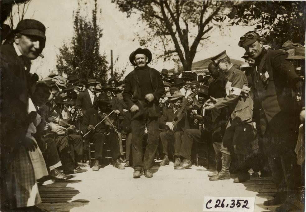 Man dancing in front of musicians, 1909 New York-Atlanta Good Roads Tour