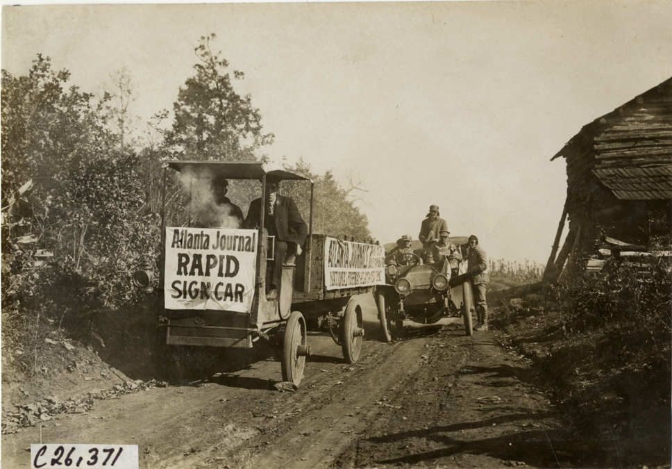 Driver and passenger in Rapid truck, 1909 New York-Atlanta Good Roads Tour