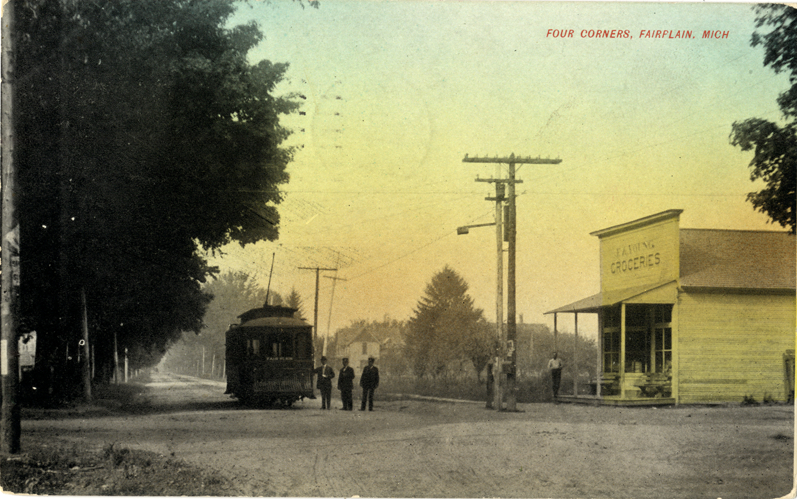Men posing next to streetcar, Fairplain, Michigan