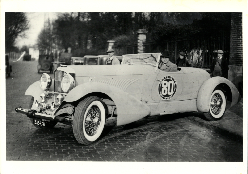 E.Z. Sadovich posing in 1931 J465 Duesenberg automobile, designed ...