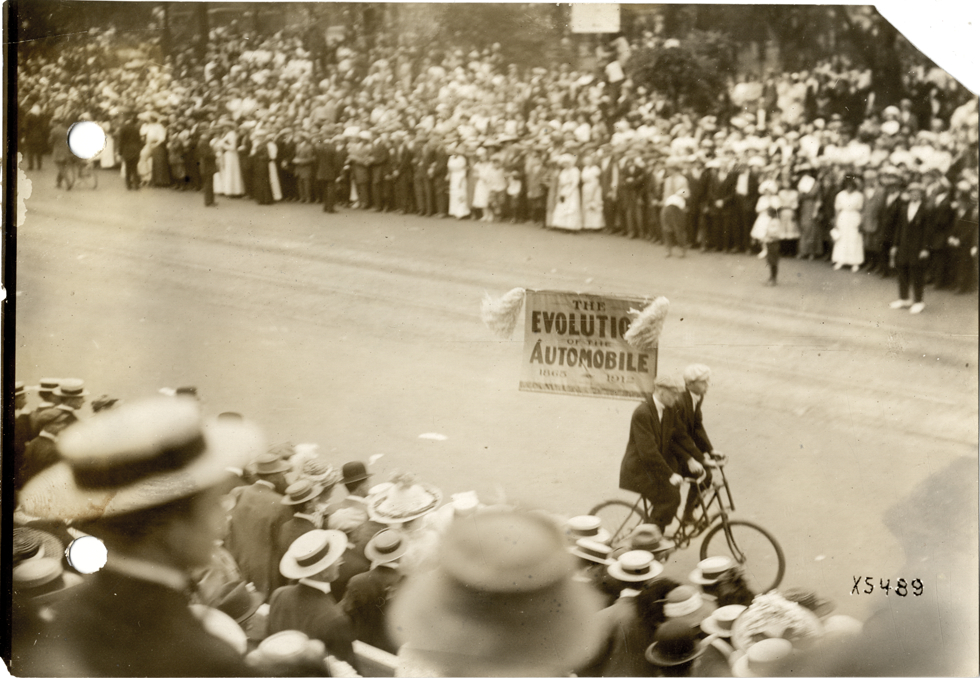 Men riding a sociable bicycle, 1912 Cadillaqua