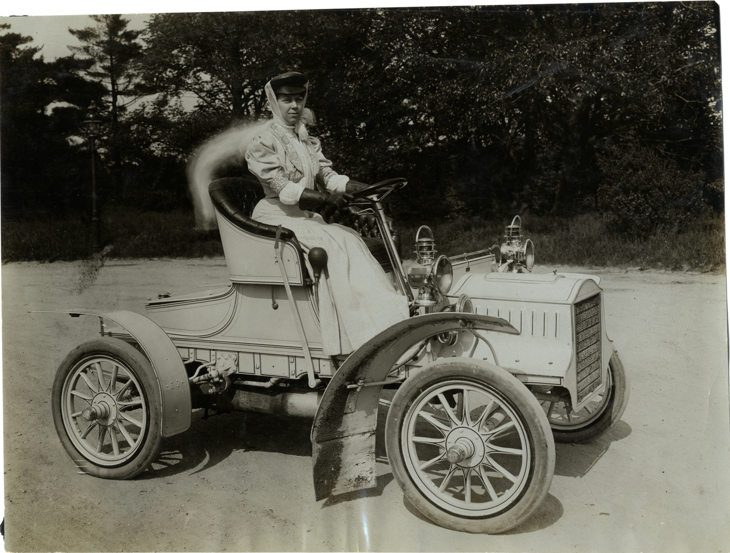 Mrs. W.C. Martin posing in 1905 Cadillac Model E automobile