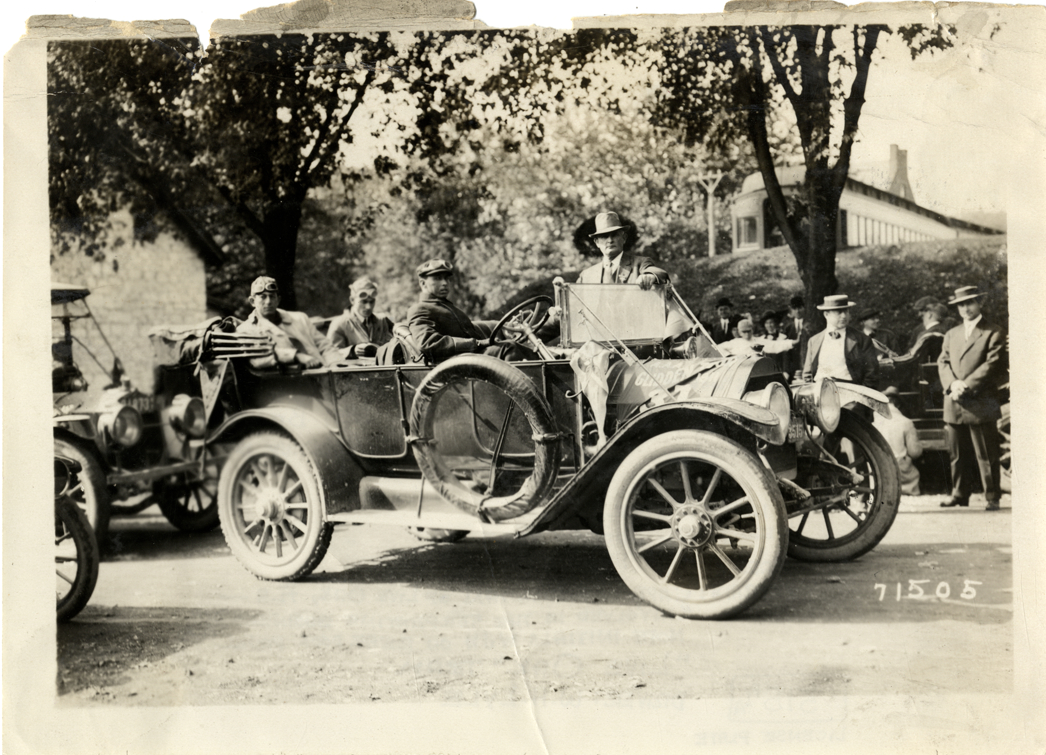 W.H. Lyle and motorists posing in 1912 Cadillac automobile, 1911 Glidden Tour