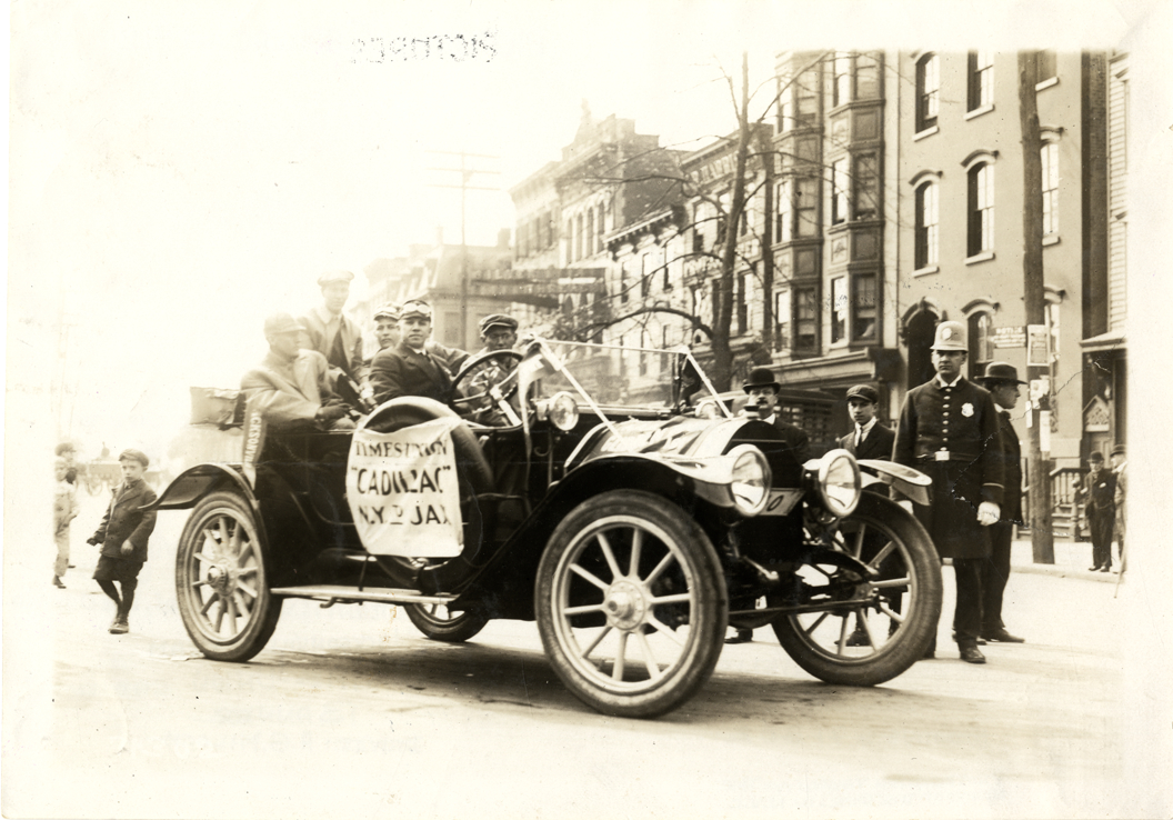 A.G. Miloch and motorists posing in 1912 Cadillac automobile, 1911 Glidden Tour