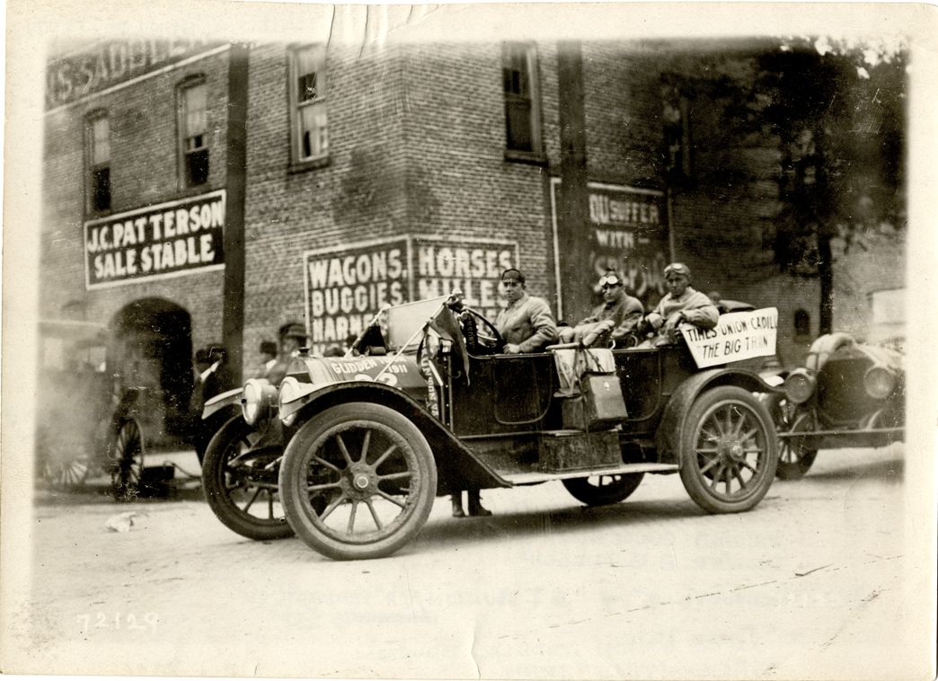A.G. Miloch and motorists posing in 1912 Cadillac automobile, 1911 Glidden Tour