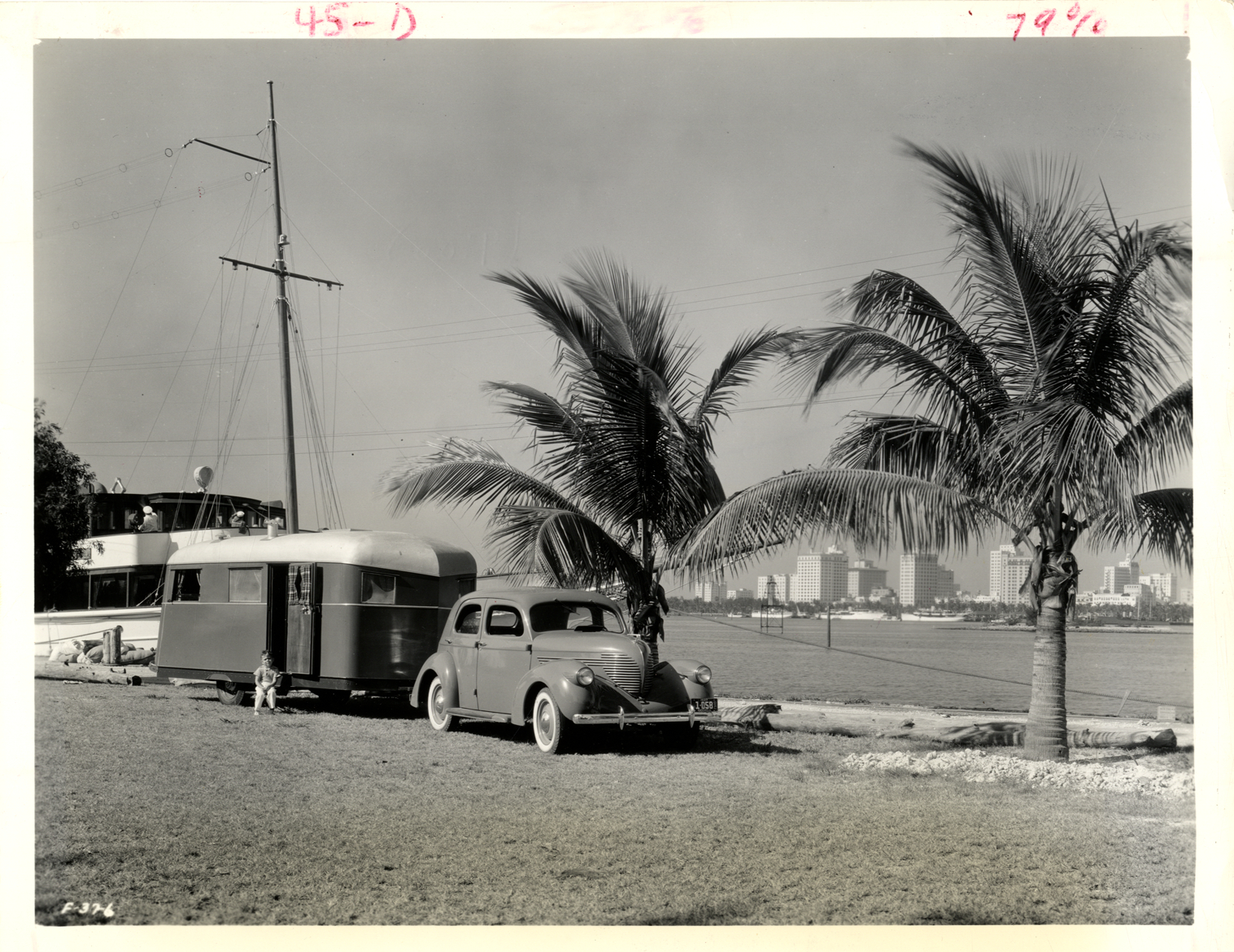 Automobile pulling a Covered Wagon trailer, Miami, Florida