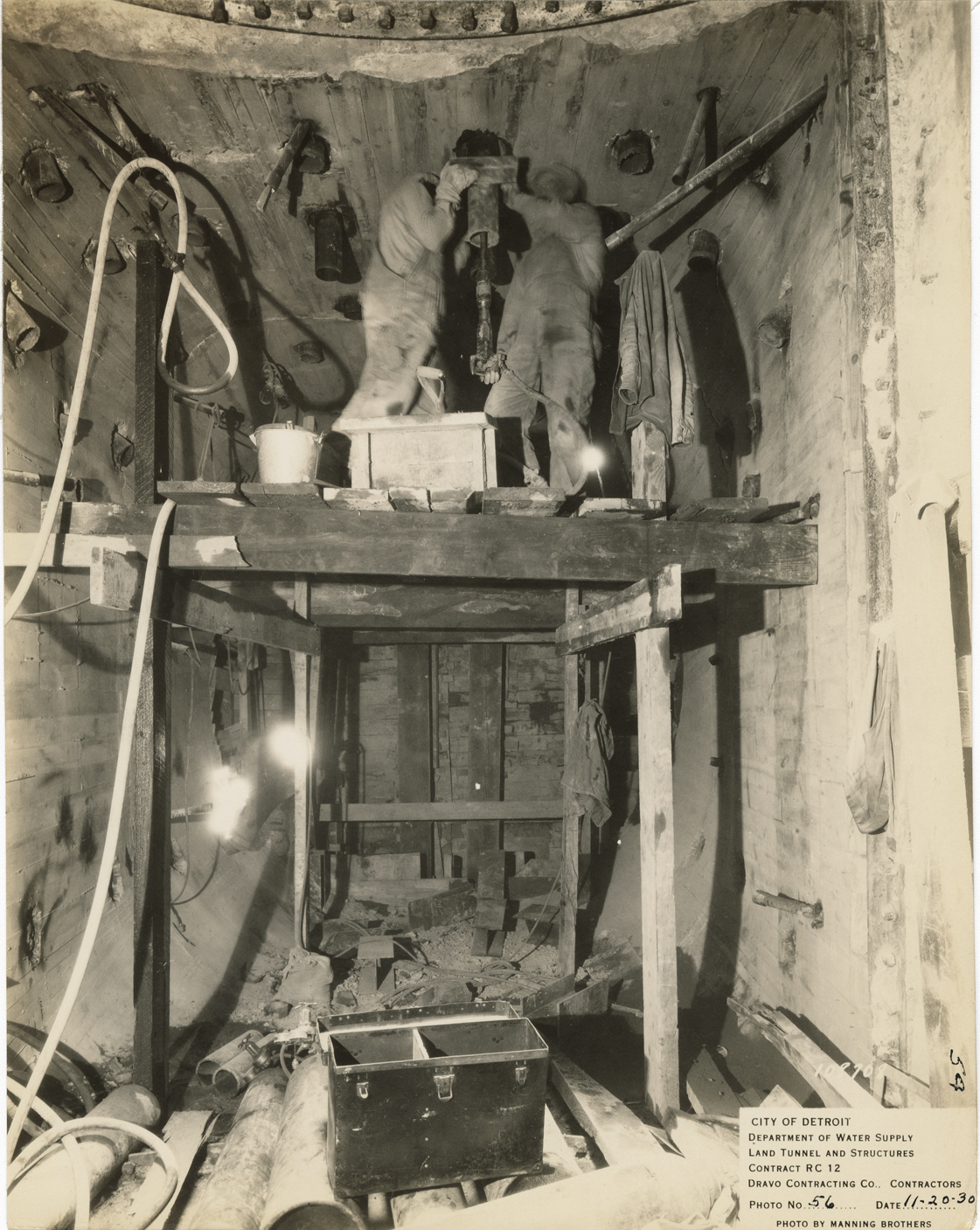 Workers in south stop log shaft, Waterworks Park, Detroit water supply system