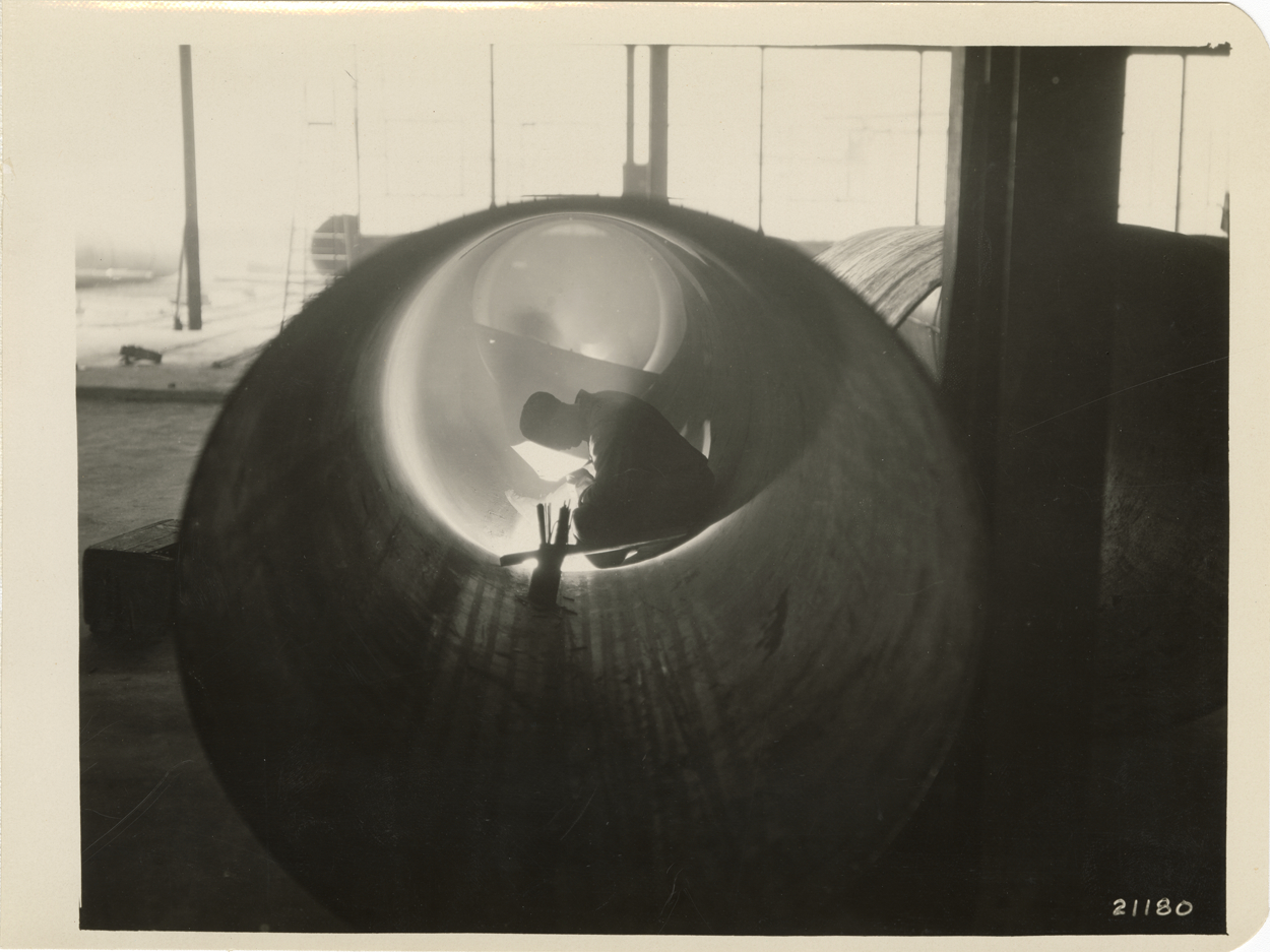 Worker welding pipe, United Welding Co. factory, Middletown, Ohio