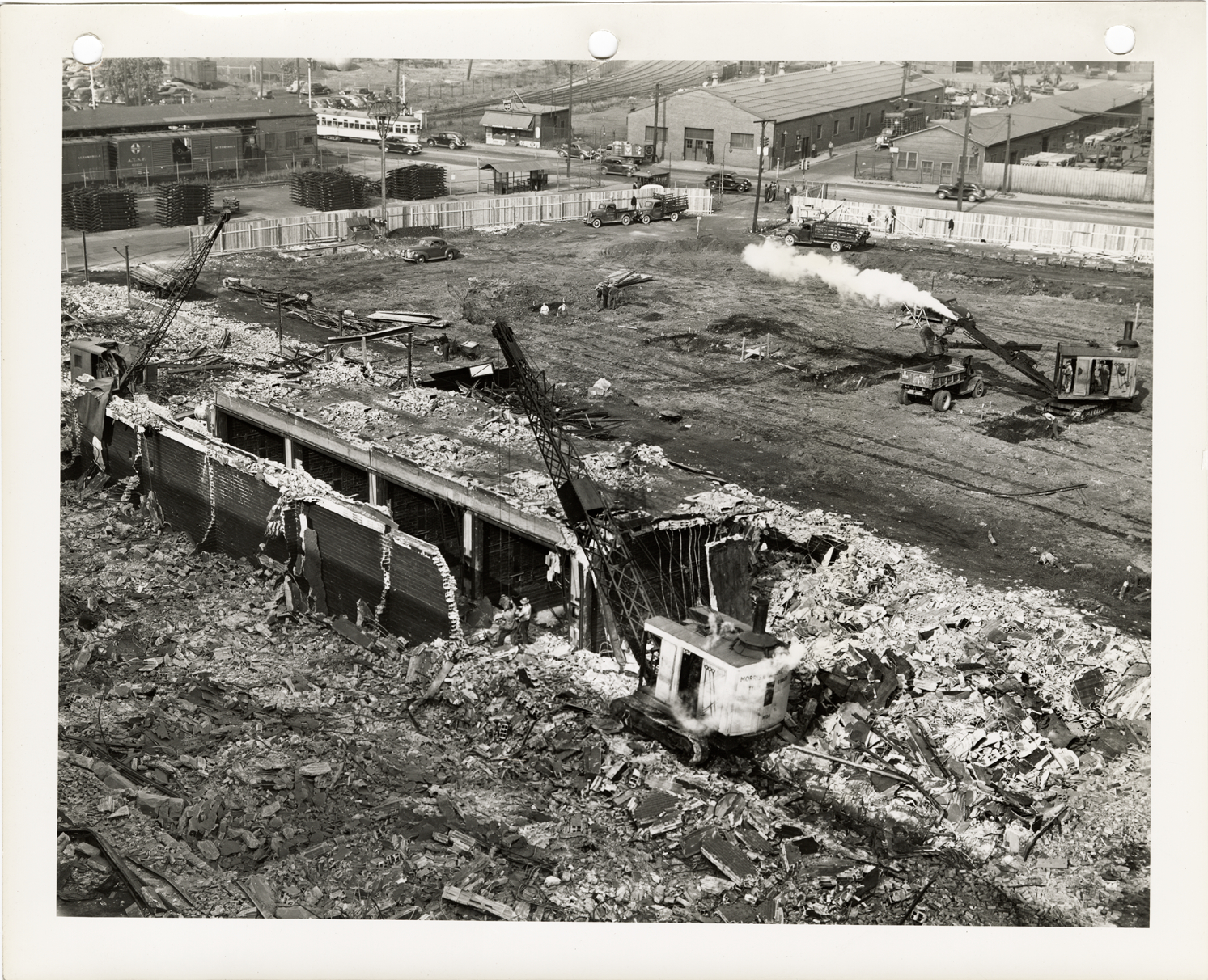Cranes demolishing buildings to prepare for building main assembly plant for Packard Rolls-Royce Merlin XX engines