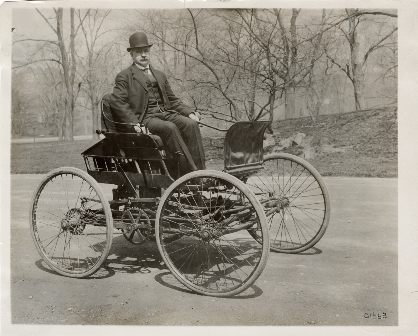 Elwood Haynes posing in 1894 Haynes-Apperson automobile