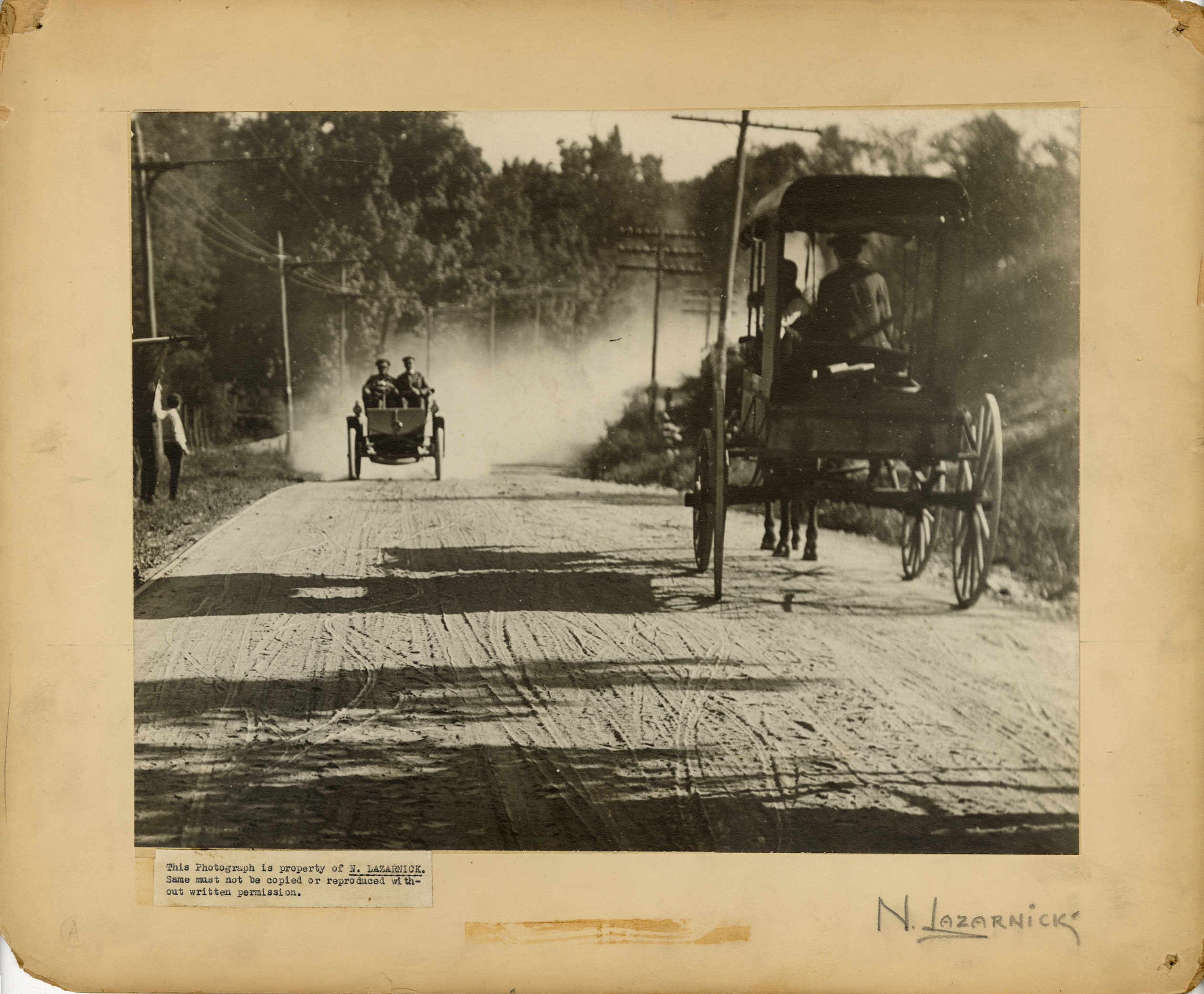 Horse-drawn buggy and automobile on road, 1904 Eagle Rock Hill Climb