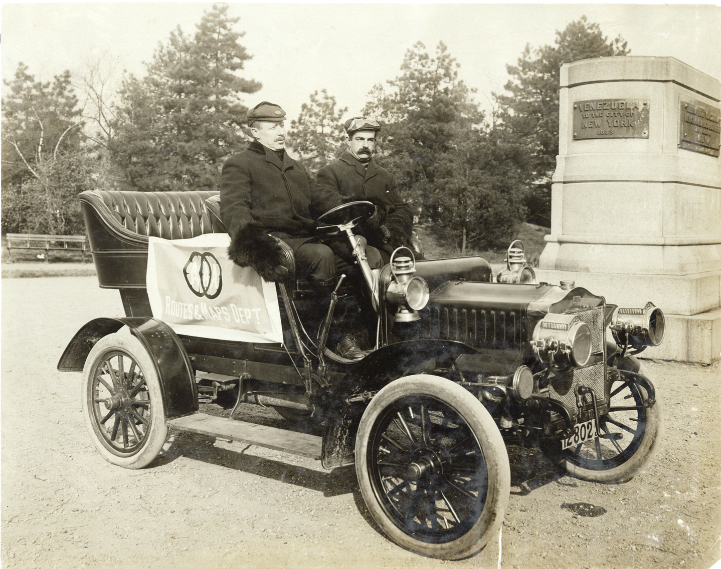 Motorists posing in Maxwell automobile