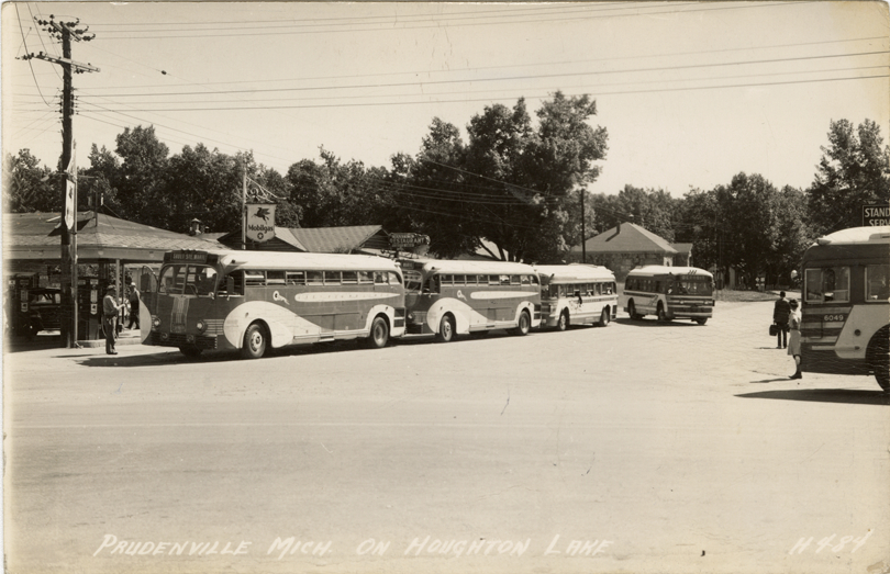 Buses at gas station, Prudenville, Michigan