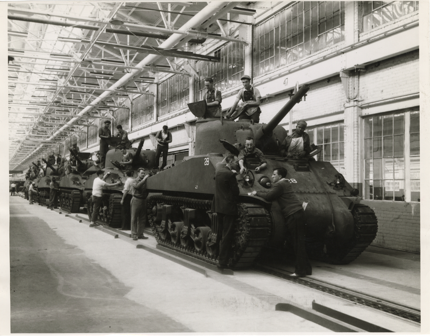 Workers assembling Ford tanks