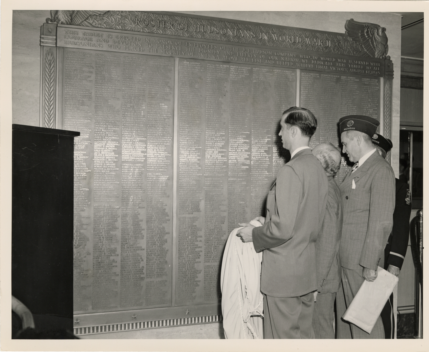 Veterans viewing roster of J.L. Hudson employees who served in World War II