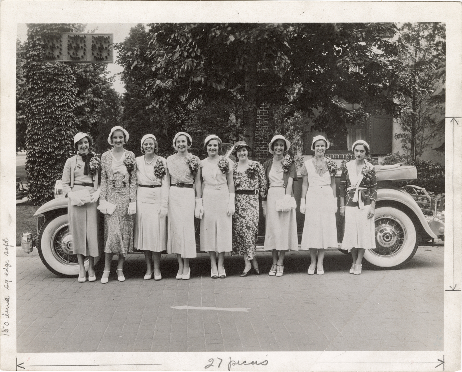Women posing with 1932 Packard automobile
