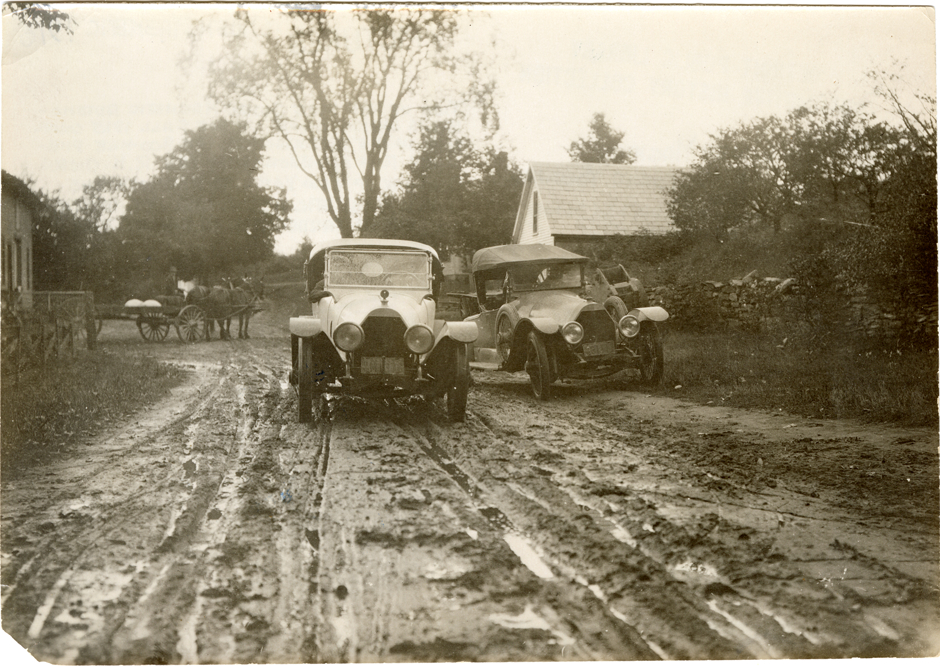 1916 Owen-Magnetic automobiles on muddy rural road