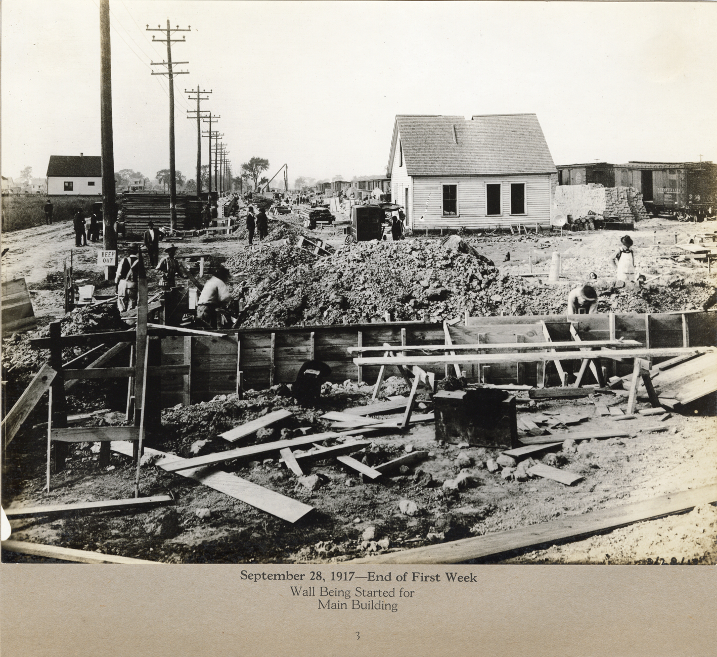 Workers constructing wall for main building, Lincoln Motor Company factory