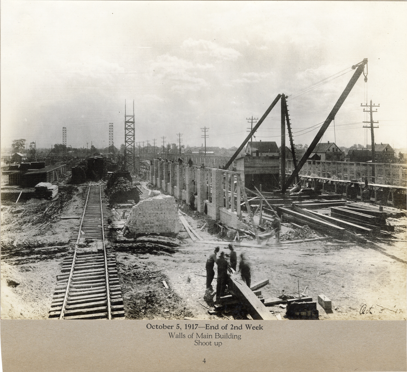 Workers constructing walls for main building, Lincoln Motor Company factory