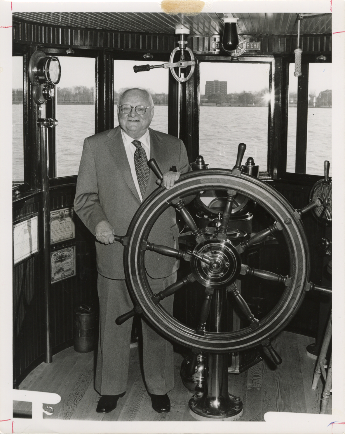 George F. Pierrot at ship's wheel, Dossin Great Lakes Museum