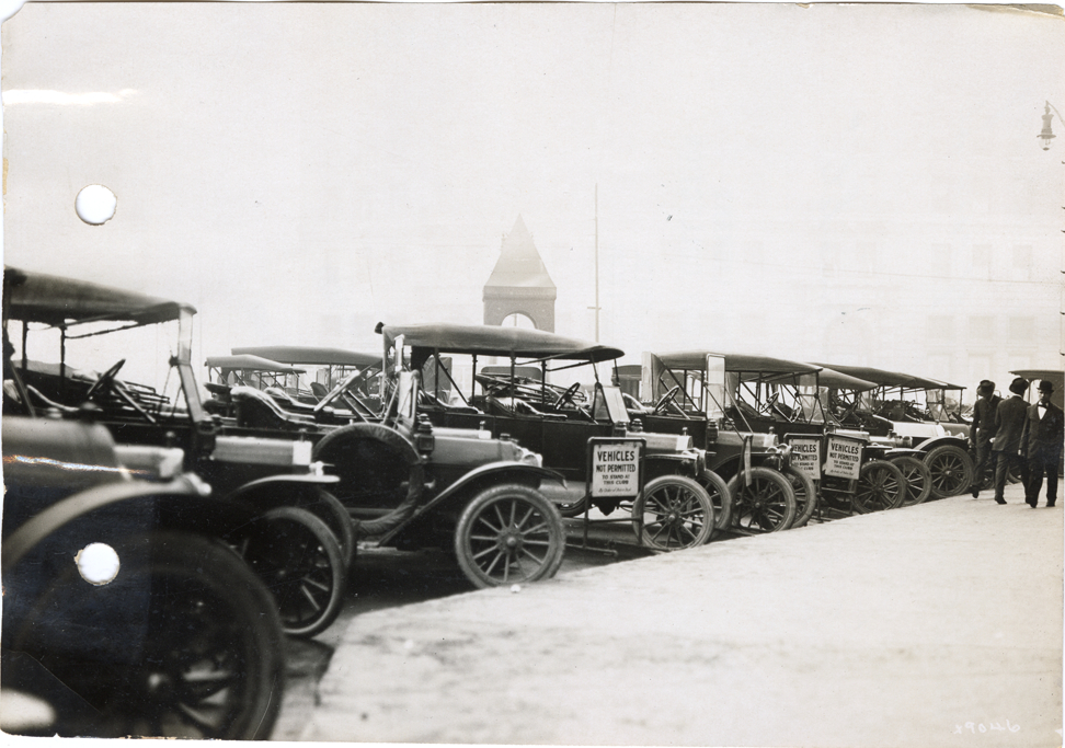 Automobiles parked at curb
