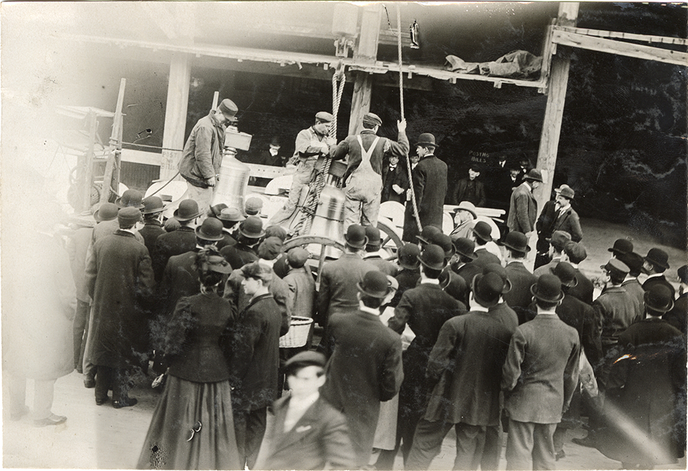 Workers with bells and hoist for the new Metropolitan Life Tower, Kissel Kar publicity stunt