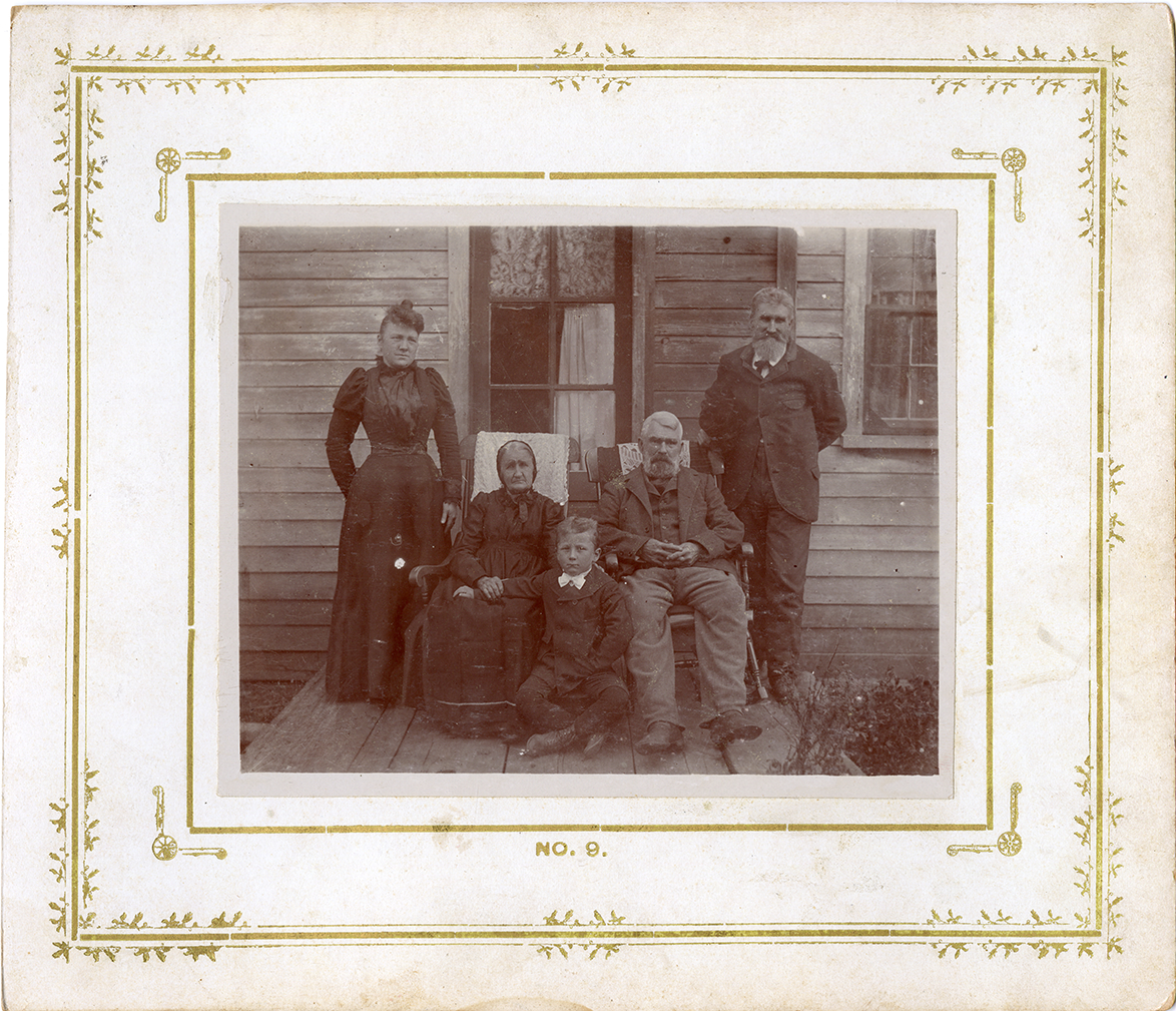 McKenzie family posing on porch, Montrose, Michigan