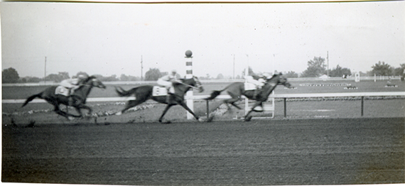 Horses crossing finish line, Hazel Park Raceway