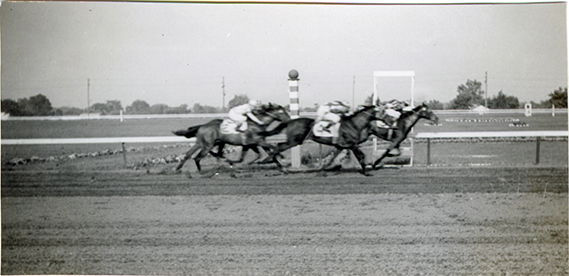 Horses crossing finish line, Hazel Park Raceway