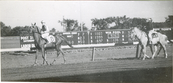 Jockeys walking horses on track, Hazel Park Raceway