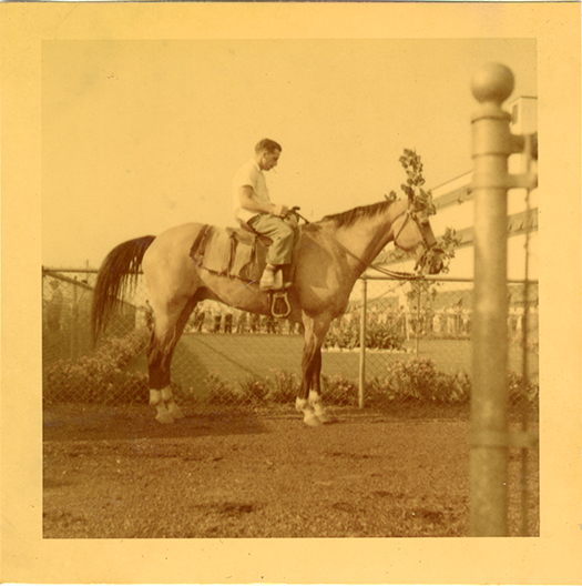 Groom on lead horse, Hazel Park Raceway