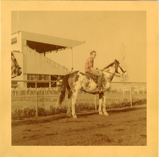 Groom on lead horse, Hazel Park Raceway