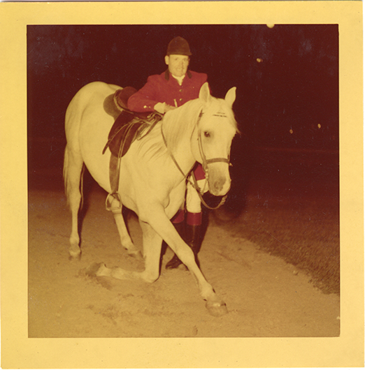 Steward James E. Stolte posing with horse "Nar," Michigan Racing Association racetrack