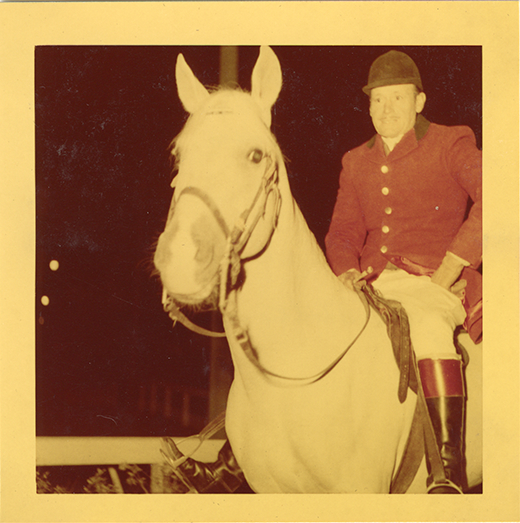 Steward James E. Stolte posing with horse "Nar," Michigan Racing Association racetrack