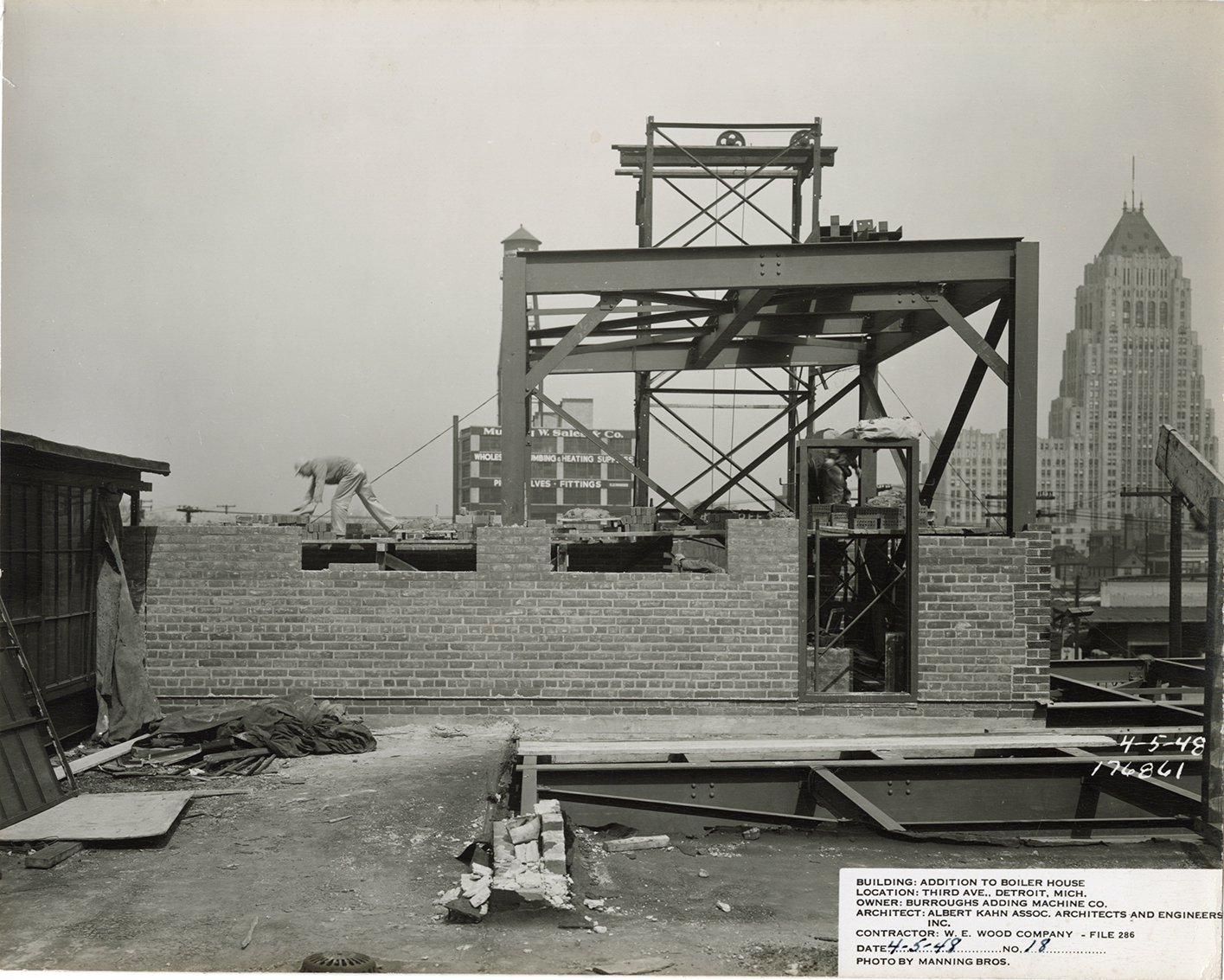 Bricklayers working on addition to boiler house, Burroughs Adding Machine Company factory