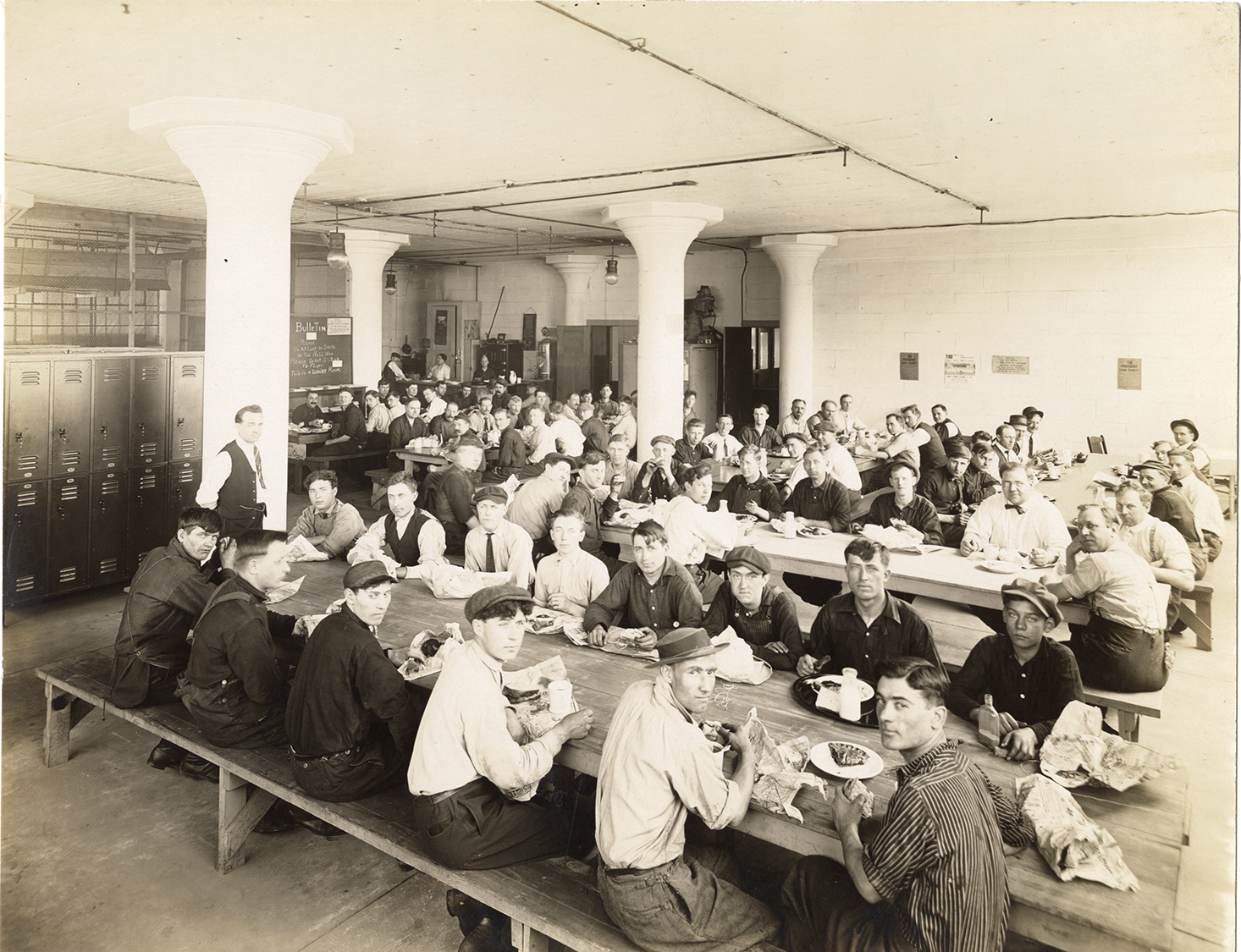 Factory workers eating lunch, Long Manufacturing Company