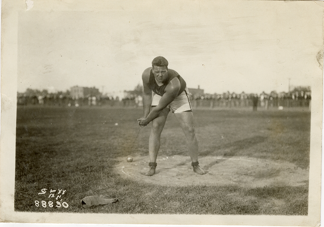 Babe White competing in hammer throw