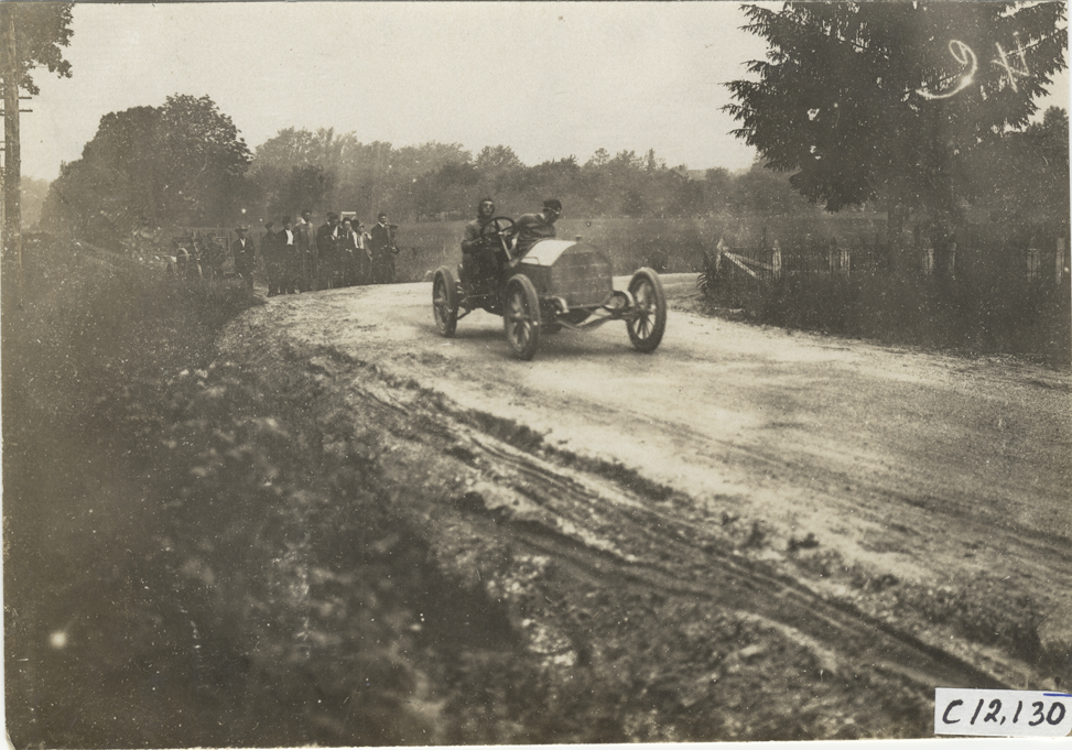 Driver and passenger in racecar, 1909 Crown Point races | DPL DAMS