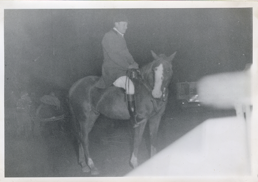 Steward James E. Stolte posing on horse "Riffles," Michigan Racing